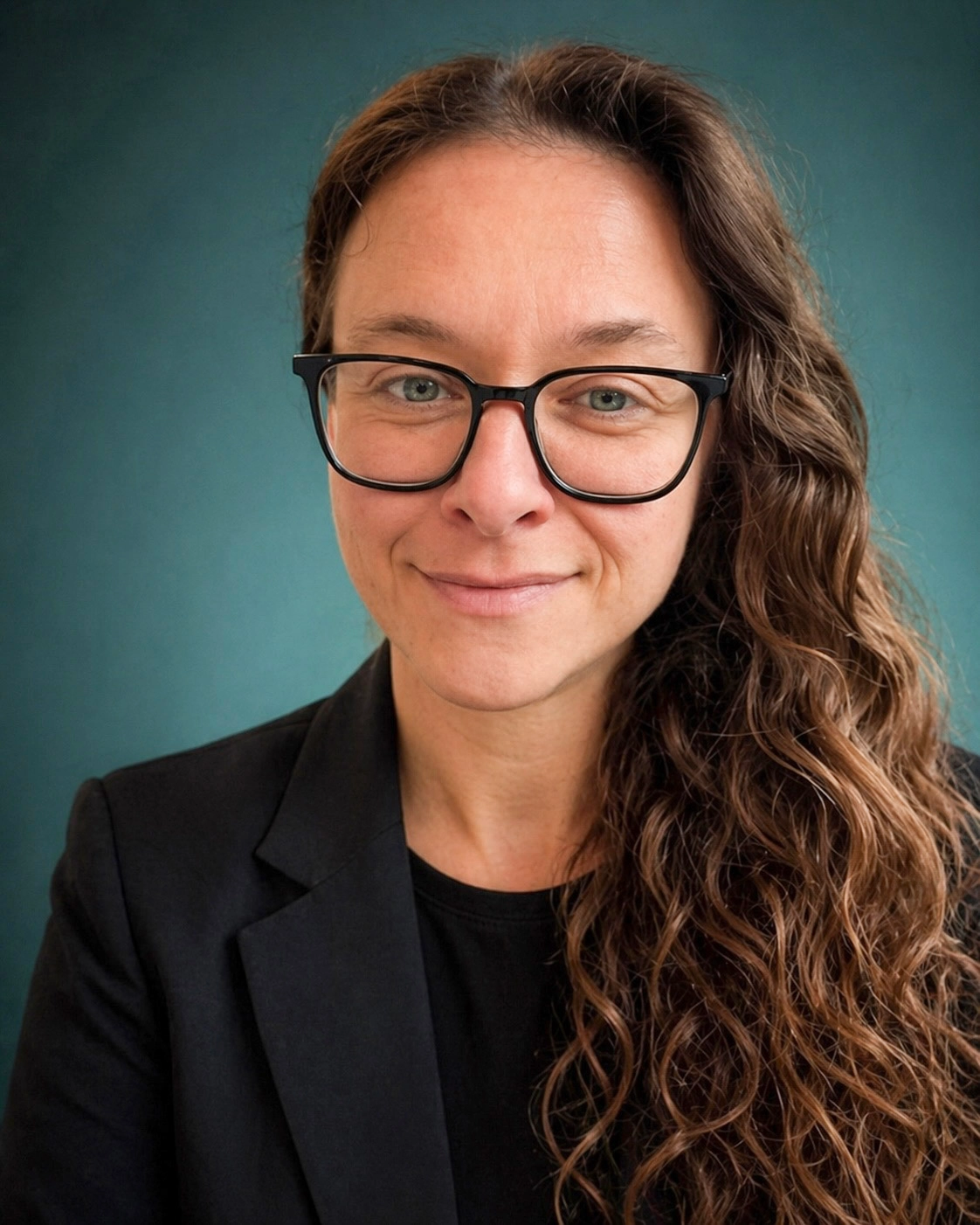 Portrait of Laurence Paquette, author of Lead Anyway, smiling against a teal background.